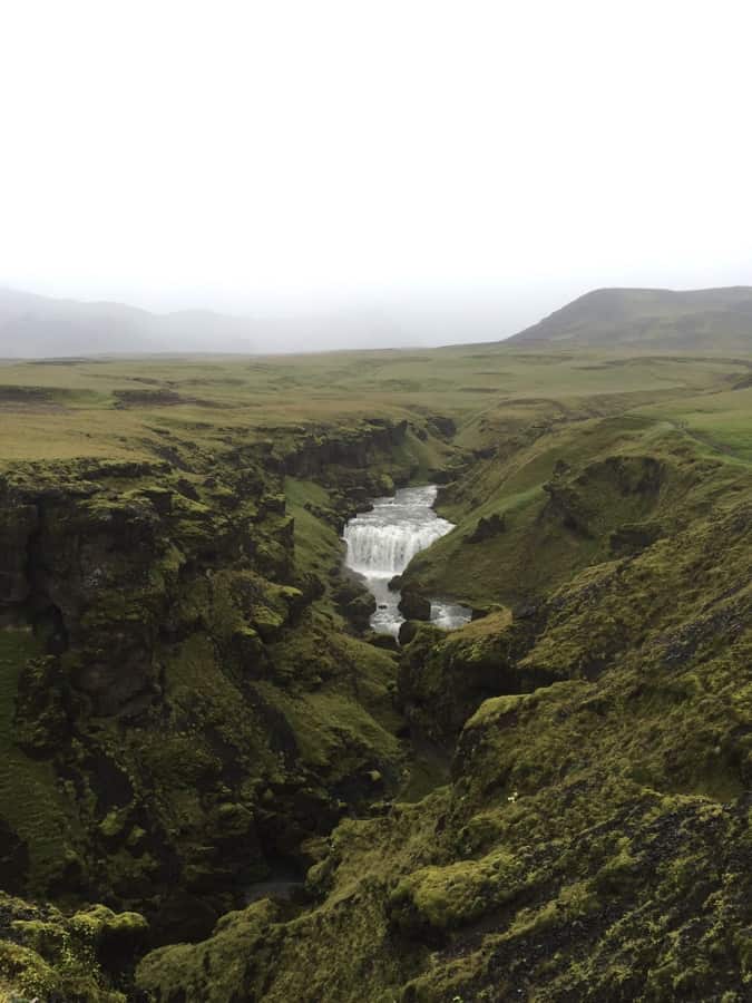Hiking beyond Skógafoss waterfall in South Iceland