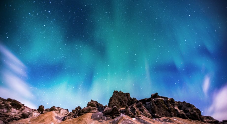 Northern Lights over mountains in Iceland.