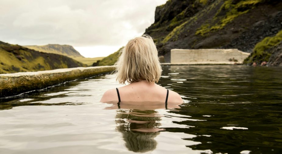 Woman in a quiet geothermal pool in Iceland