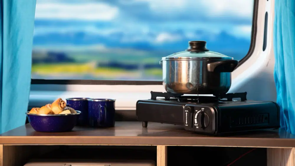 Kitchen setup inside a campervan in Iceland.