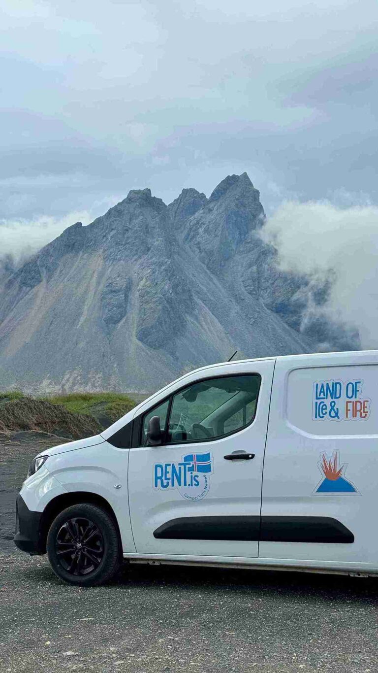 Fiat Doblo parked infront of a mountain