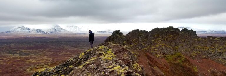 Man on top of mountain