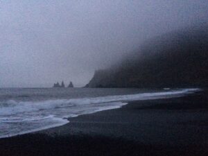 A dim Black sand beach