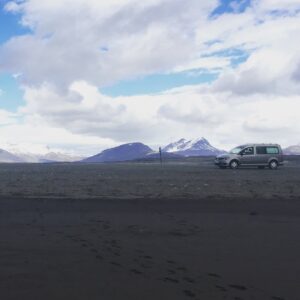 Camper on a black sand beach Camper on a black sand beach
