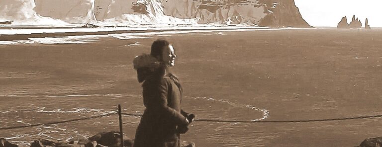 woman smiling standing outside with mountains