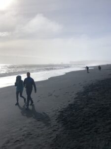 Enjoying the black sand beach Reynisfjara Enjoying the black sand beach Reynisfjara