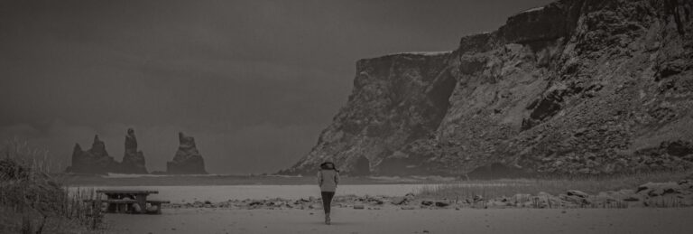 Person walking on a snowy beach
