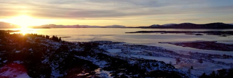 sunset over fields with snow