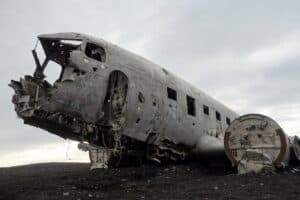 The DC-3 plane on black sand The DC-3 plane on black sand