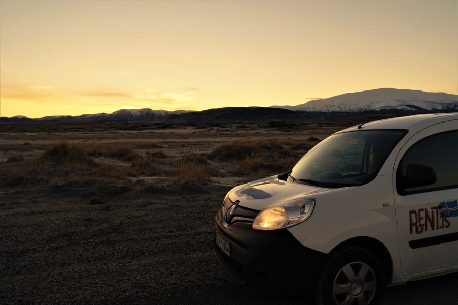 A camper van in the setting sun