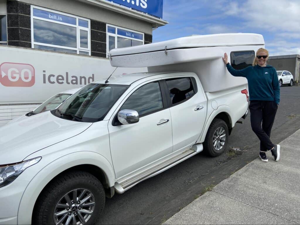 woman leaning on rent.is campervan