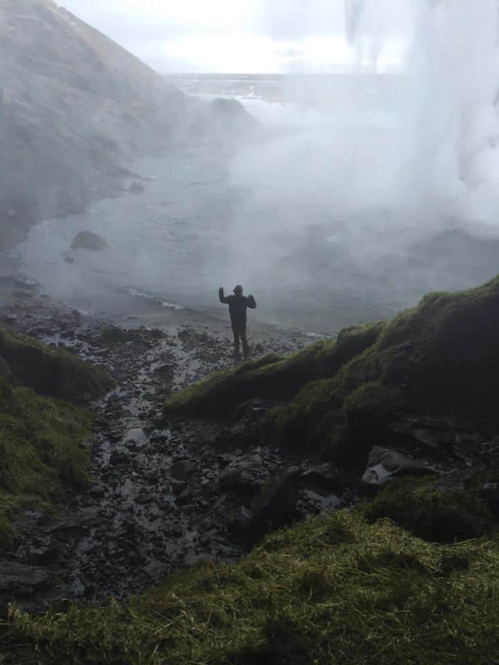 Going behind Seljalandsfoss waterfall