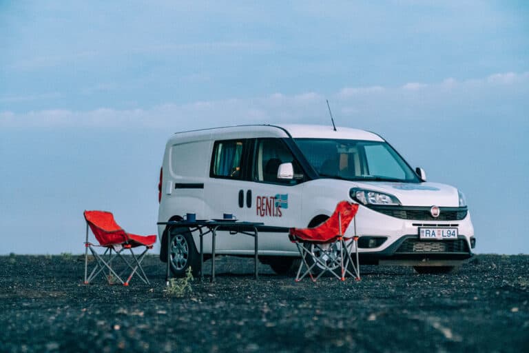 rent Fiat Doblo Maxi Campervan, camping chairs table, black sand beach