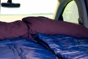 Rent VW Caddy Camper interior sleeping bags pillows