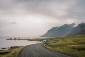 rent renault master 5 campervan driving on road in Iceland mountains nature