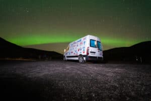 rent renault master 5 campervan under northern lights in Iceland