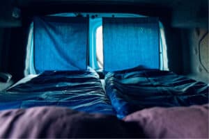 Rent renault kangoo camper interior sleeping bags curtains closed