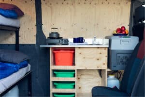 Rent Renault Master 5 interior kitchen area shelves griddle sink