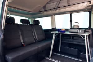 Rent vw california 4x4 vamper van interior passenger seats table stove