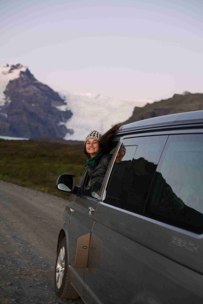 VW California older on the road pink skies