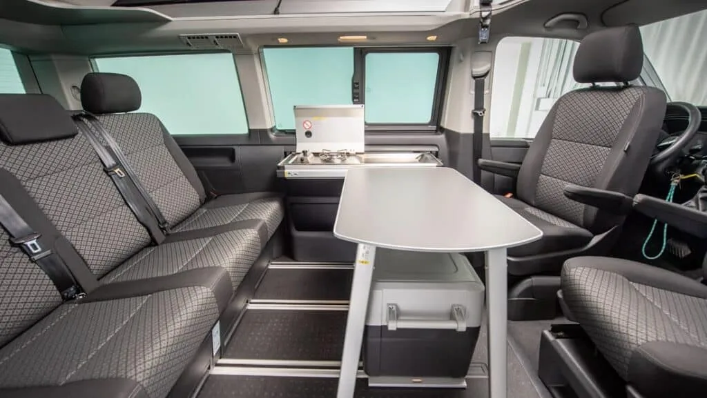Rent California Beach 4WD camper van passenger seats table stove