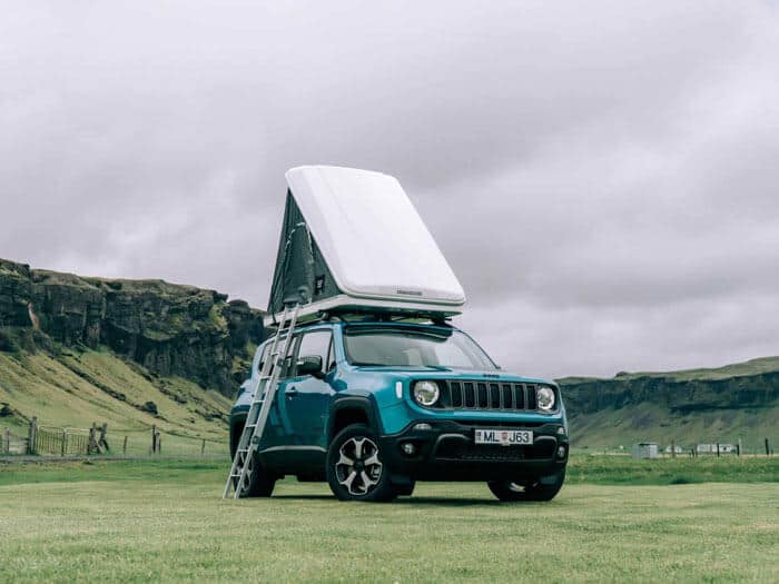 Jeep Renegade 4x4 roof top tent set up at campsite in Iceland.