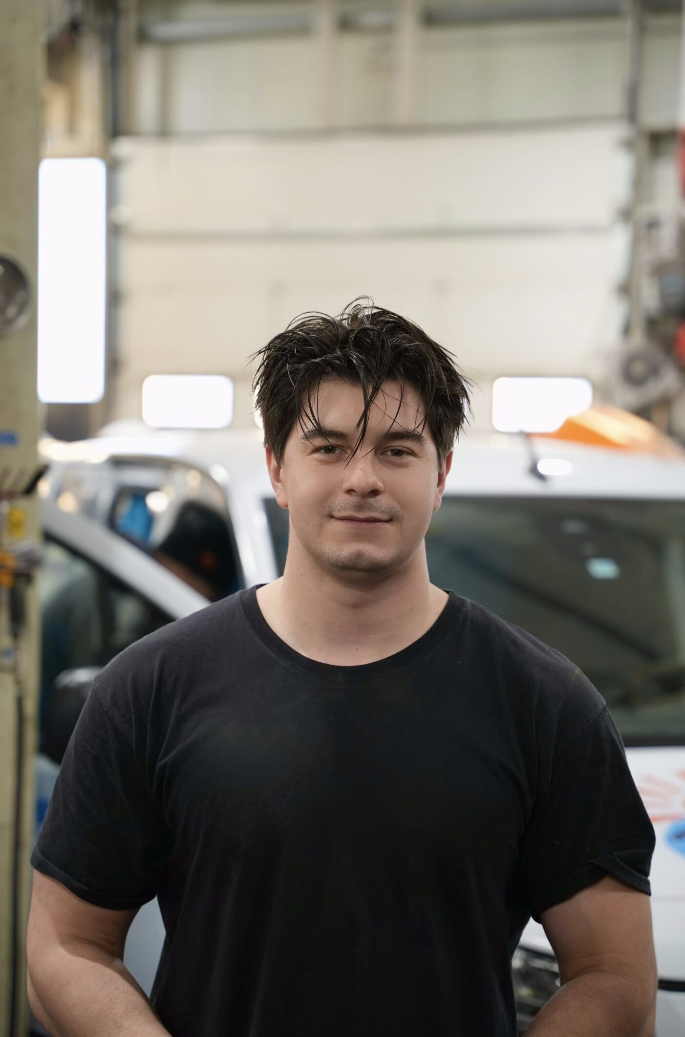 Maintenance worker posing in garage