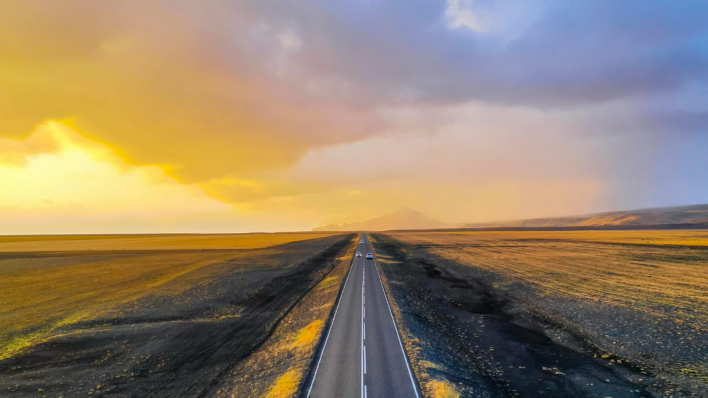Open road in Iceland at sunset.