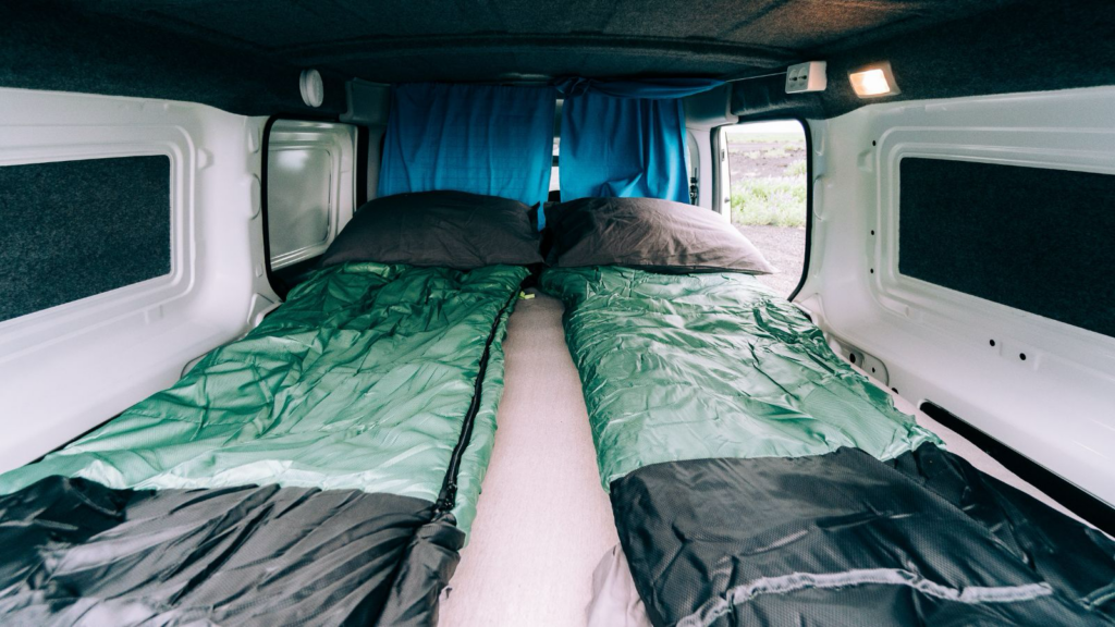 Two sleeping bags inside a camper van in Iceland.