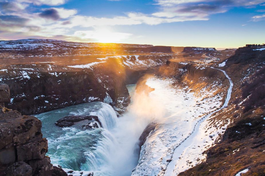 Aerial view of Gullfoss dusted in snow on a bright day.