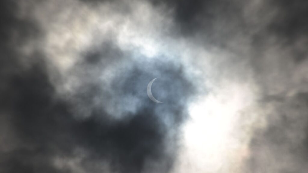 Total solar eclipse through cloud cover
