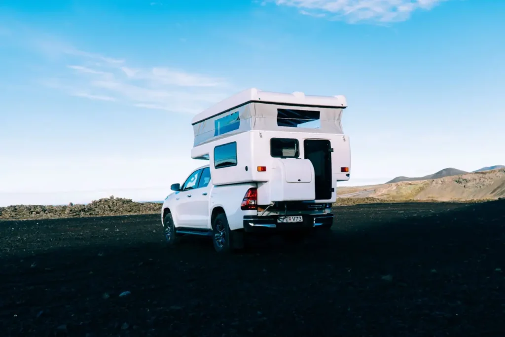 Shot of the back of a Toyota Hilux automatic campervan with tent setup 