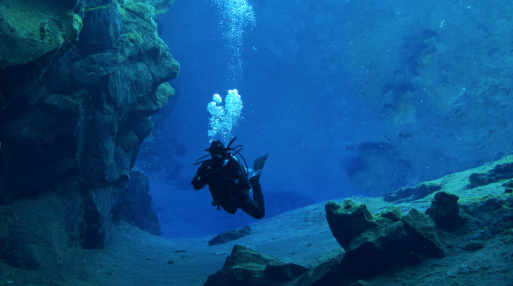 Scuba diver at Silfra fissure in Iceland.