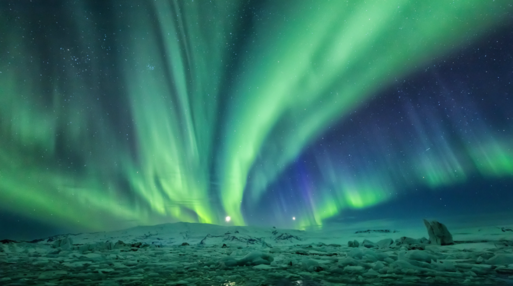 Northern Lights over Jökulsárlón glacier lagoon in winter.