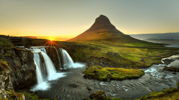 Kirkjufell mountain and waterfall at sunset in Iceland