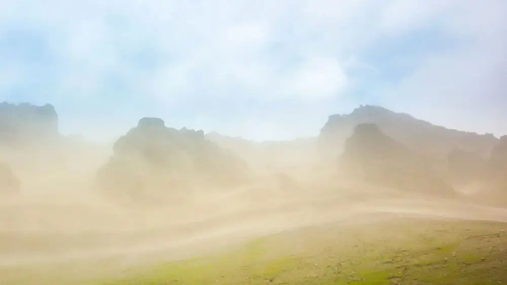 Wind and dust blowing across the landscape in Iceland.