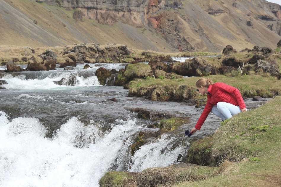 Thirsty, grabbing a drink from a waterfall
