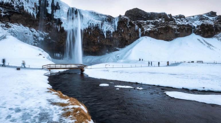 Frozen waterfall in Iceland during winter.