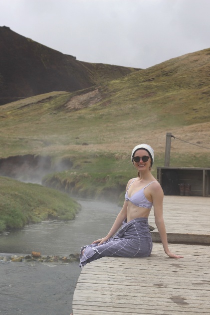 Sitting on the bank of a hot river