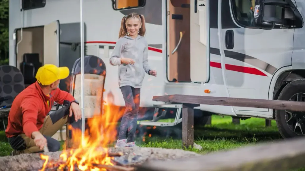 Family in a camper van camping in Iceland