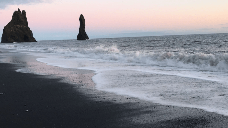 Reynisfjara Black Sand Beach in Iceland at sunset.