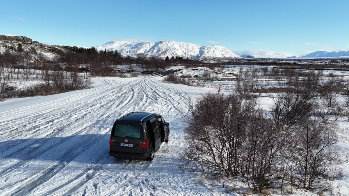 Campervan parked on a snowy riad