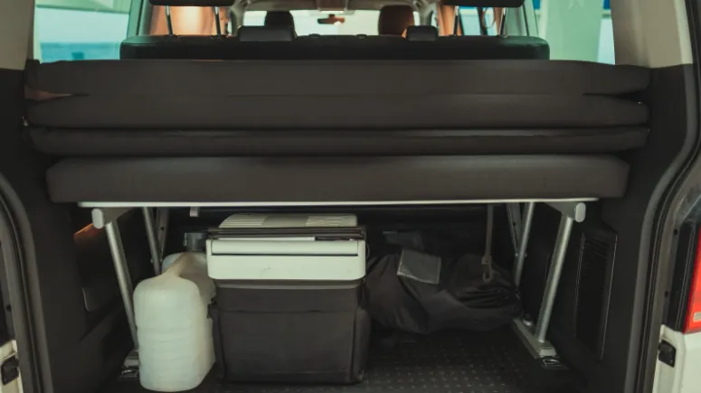 Luggage storage area in a camper van.