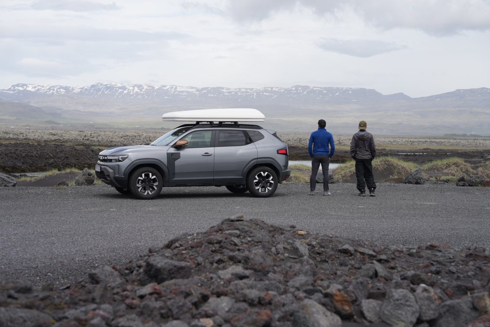 Dacia Duster with roof top tent beside moss-covered lava fields along the Ring Road