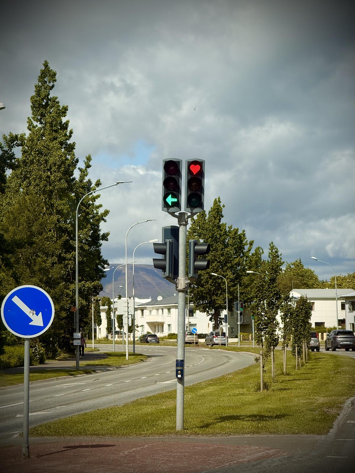 Heart-shaped red traffic light on a street in Akureyri, North Iceland