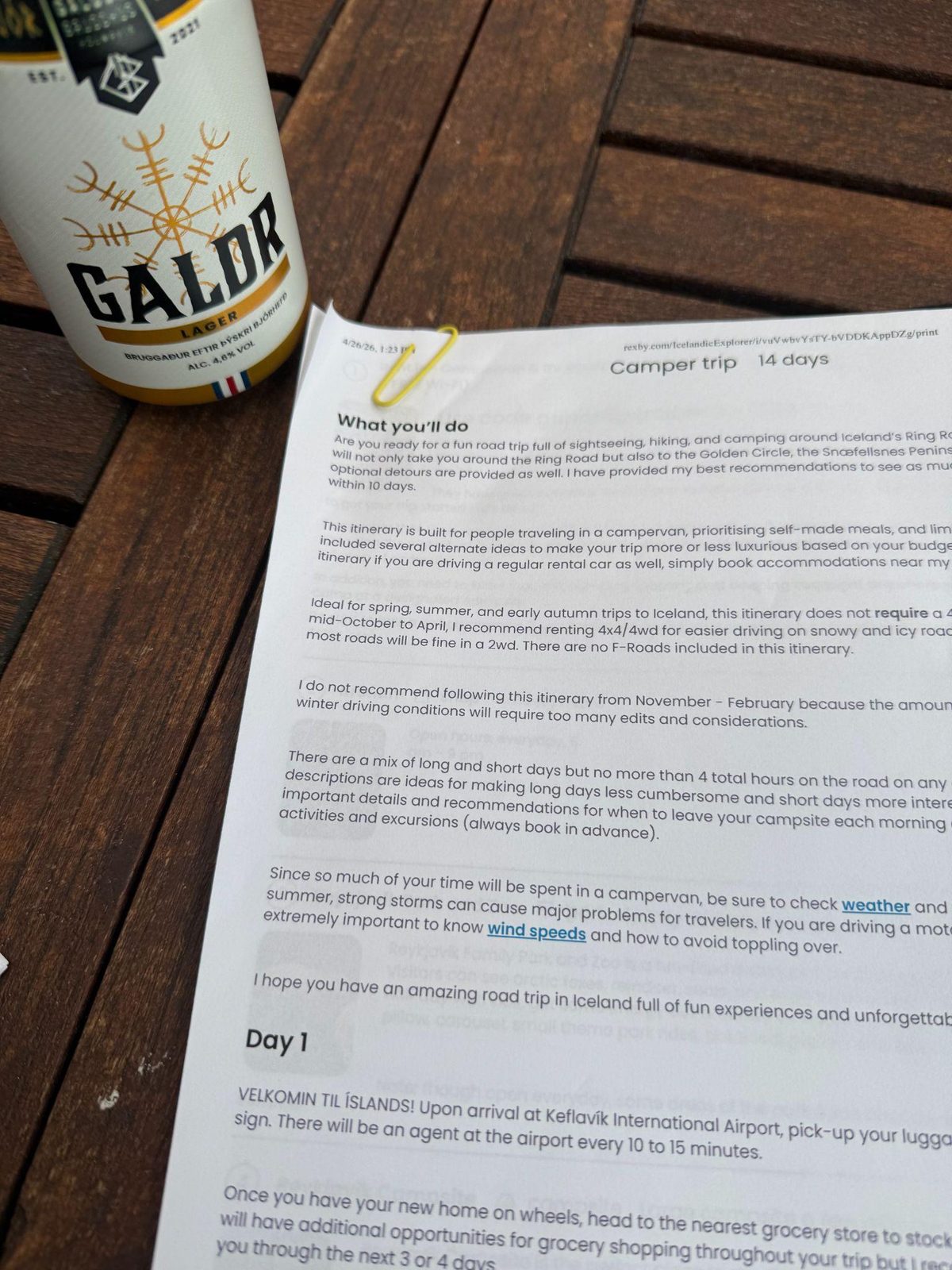 Printed Iceland campervan itinerary with kids next to a can of Icelandic Galdr beer
