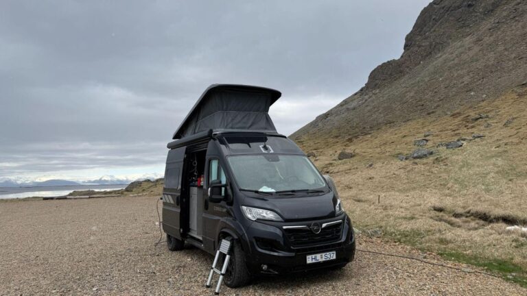 Campervan parked with pop up tent open
