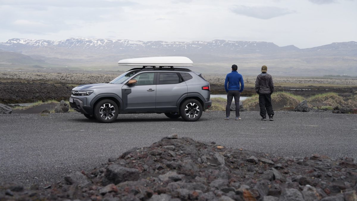 Duster parked and friend standing
