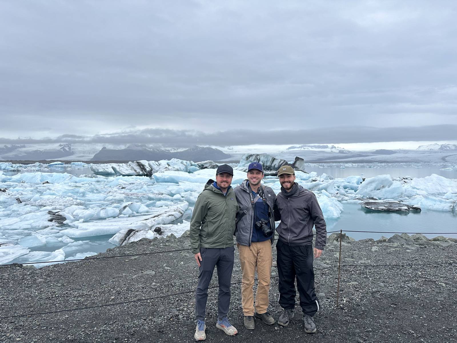 Three friends at Jökulsárlón Glacier Lagoon on an Iceland road trip with friends