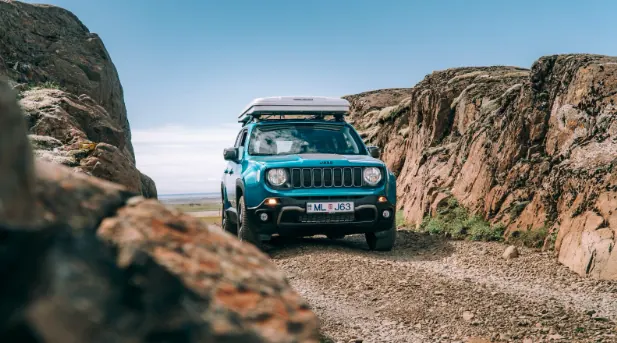 Jeep Renegade 4xe on rugged Icelandic terrain.